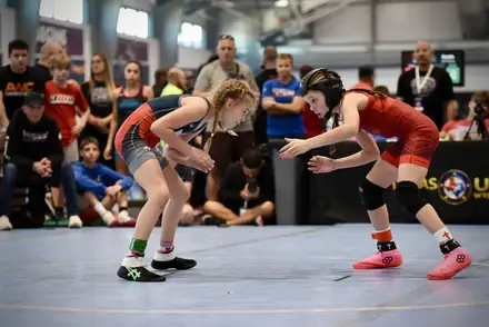 Two young girls set up their attacks at a state tournament