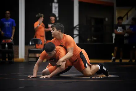 Two Aledo wrestlers working from the down position during practice