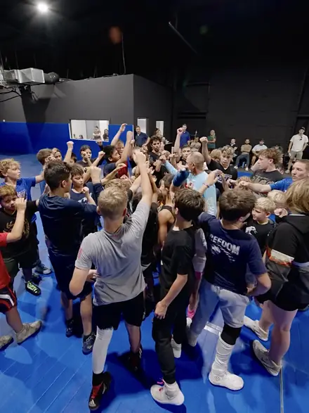 The whole camp huddled up with fists raised at the end of the night.