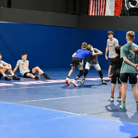 AWC wrestlers rotating partners during a technique block.