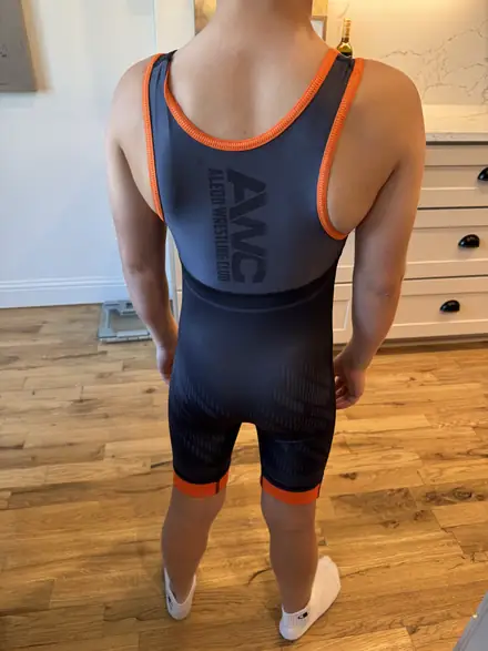 The navy AWC club singlet with the orange club logo across the chest