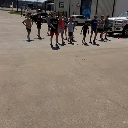 AWC athletes lined out on an outdoor conditioning run.