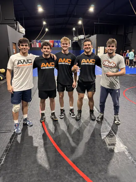 The AWC squad lined up in club gear on the mat