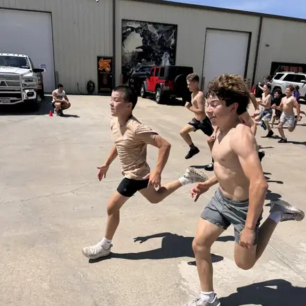 Two AWC athletes racing to the line at the end of a sprint.