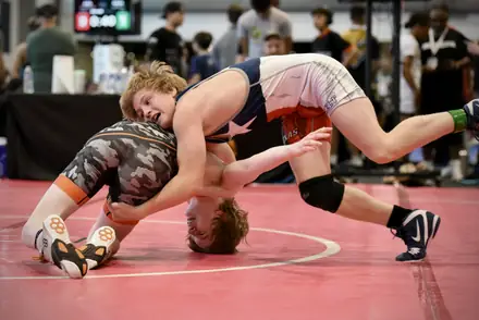Two wrestlers battle for the takedown at a Texas USA Wrestling event